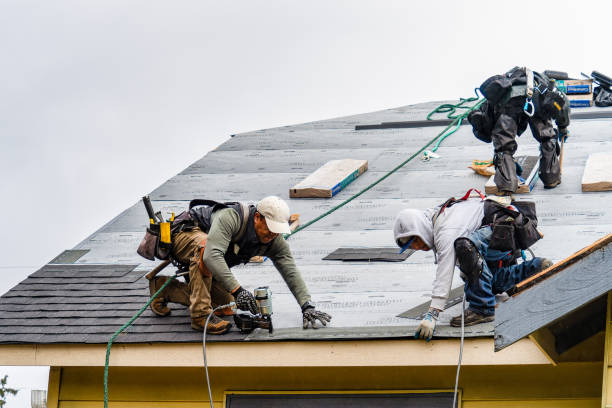Professional Gutter Installation technician working in Greenlawn, NY